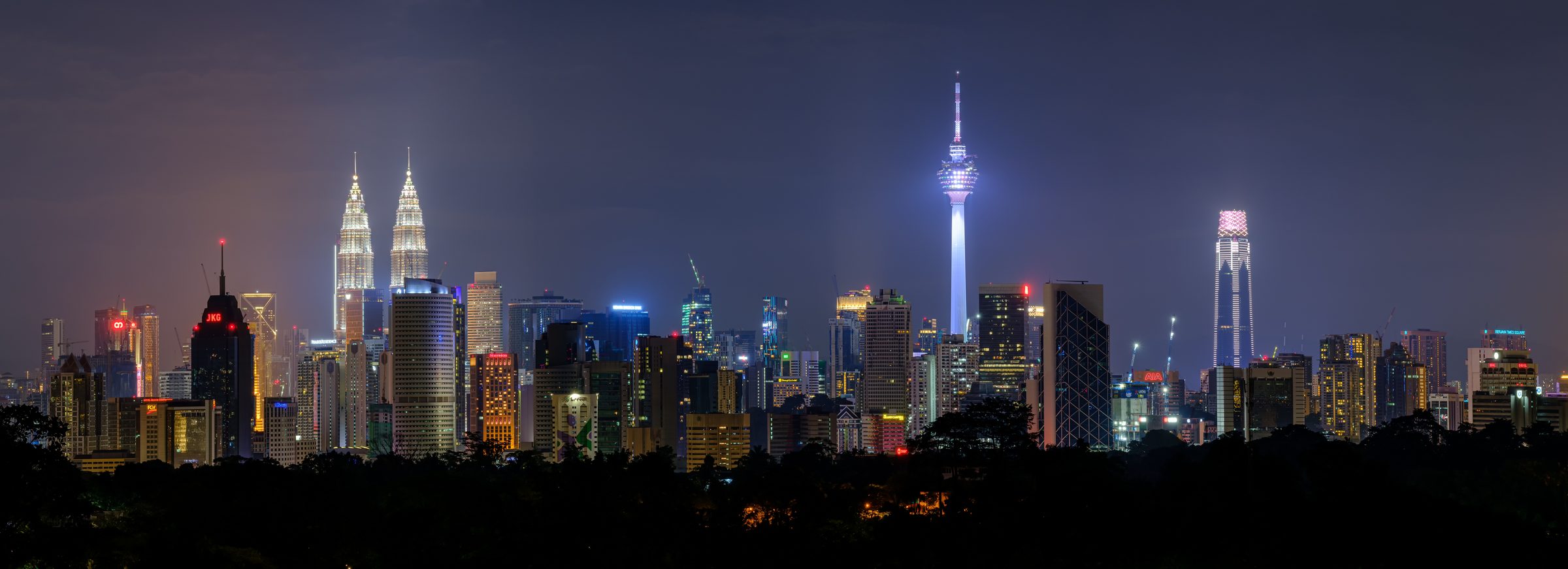 Kuala Lumpur skyline at night — where Axis Commerce is based